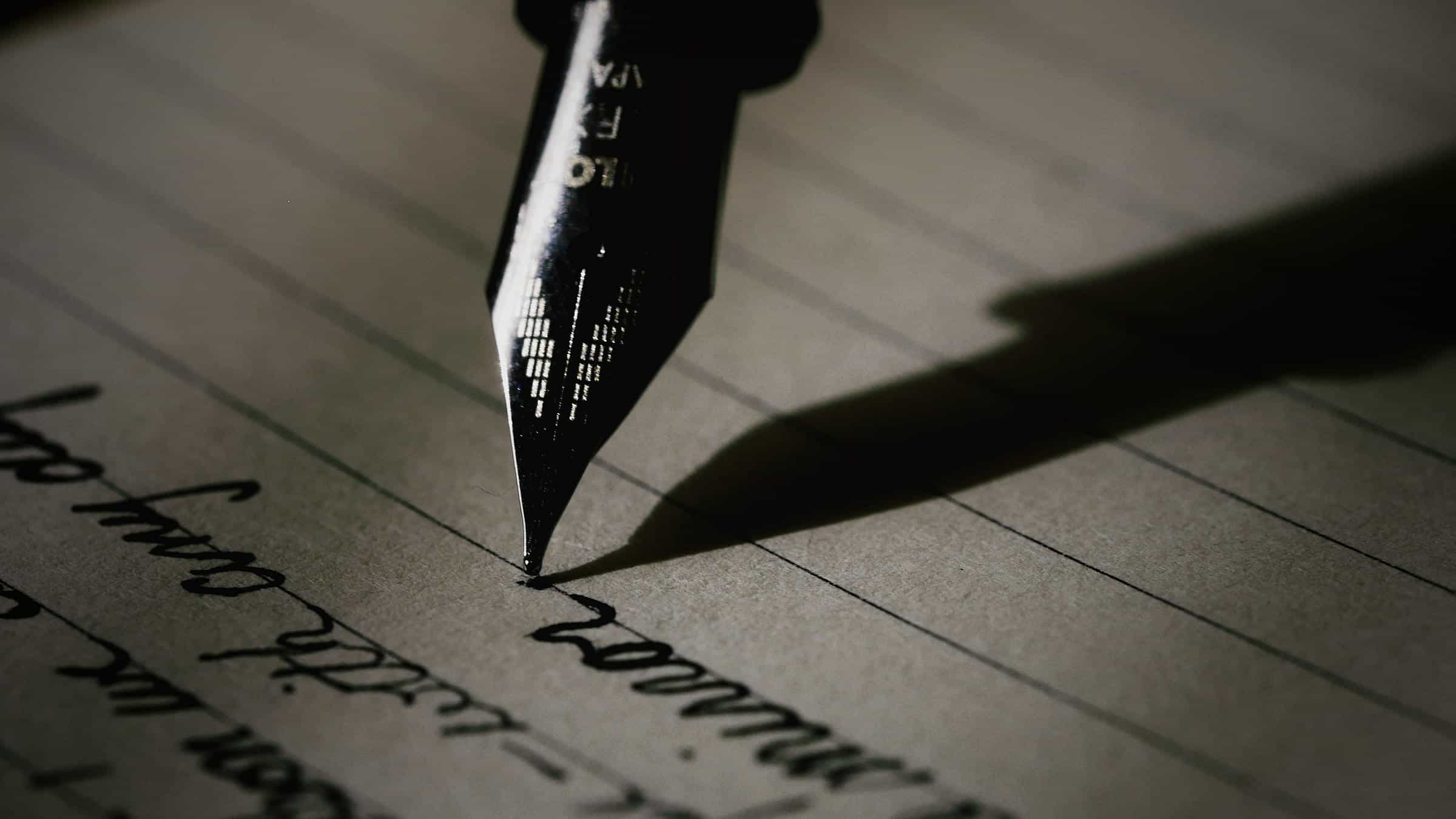 A fountain pen writing a letter